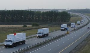 669584-a-russian-convoy-of-trucks-carrying-humanitarian-aid-for-ukraine-drives-along-a-road-near-the-city-o